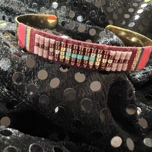 #5. Beautiful hand beaded gold tone cuff with Navaho vibe